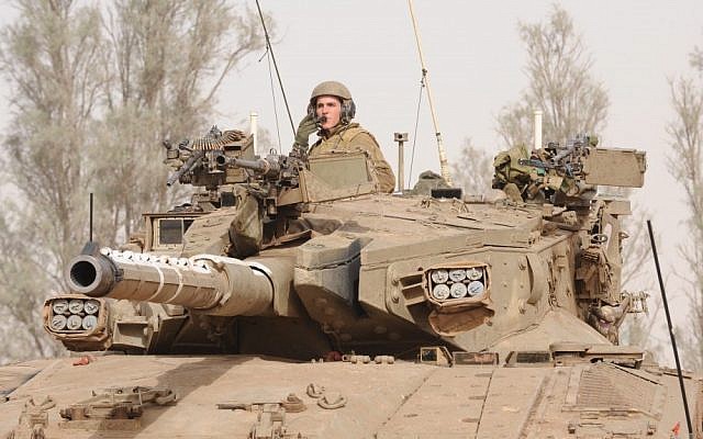Israeli soldiers are preparing their tanks along the border with Gaza on Friday, ahead of a possible ground incursion into the Strip (photo credit: Gili Yaari/Flash90) Israeli soldiers are preparing their tanks along the border with Gaza on Friday, ahead of a possible ground incursion into the Strip (photo credit: Gili Yaari/Flash90)
