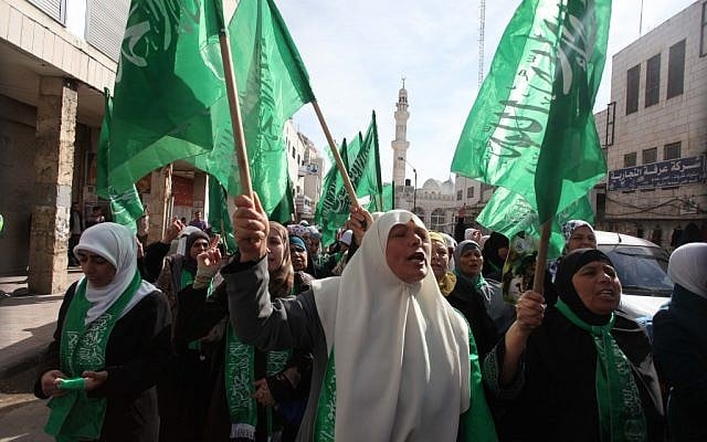 Palestinians wave Hamas flags during a demonstration in solidarity with Gaza and against Israel's military operation in the coastal enclave, in the WestBank city of Ramallah November 16, 2012 (photo credit: Issam Rimawi/Flash90) Palestinians wave Hamas flags during a demonstration in solidarity with Gaza and against Israel's military operation in the coastal enclave, in the WestBank city of Ramallah November 16, 2012 (photo credit: Issam Rimawi/Flash90)