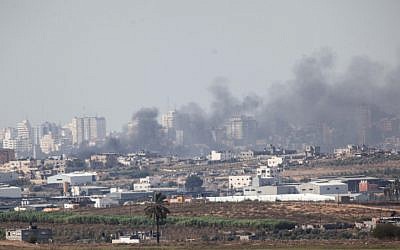 Smoke rises from a building in the northern Gaza Strip after an Israeli airstrike on November 16, 2012 during Operation Pillar of Defense. (photo credit: Uri Lenz/Flash90)