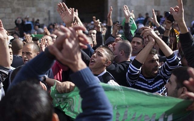 Palestinians protest in support of the people of the Gaza Strip and against Israel's military operations, at the Damascus Gate in Jerusalem's Old City, on Friday (photo credit: Yonatan Sindel/Flash90) Palestinians protest in support of the people of the Gaza Strip and against Israel's military operations, at the Damascus Gate in Jerusalem's Old City, on Friday (photo credit: Yonatan Sindel/Flash90)
