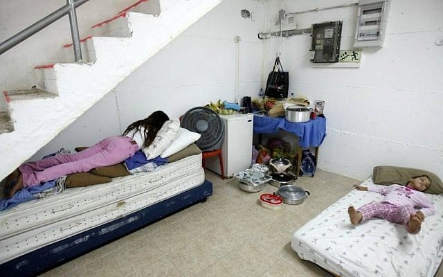 Israeli children sleeping in a bomb shelter in the southern city of Ashkelon on Friday (photo credit: Edi Israel/Flash90)