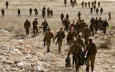 Israeli soldiers participate in a training exercise  simulating fighting in Gaza, at a training base in the Negev on November 17 (photo credit: Edi Israel/Flash90)