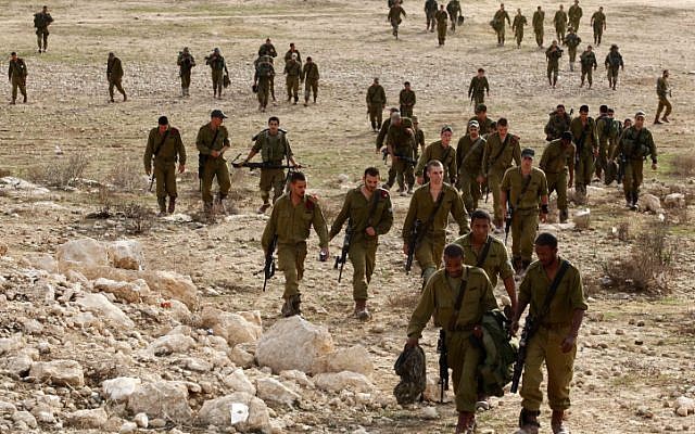 Israeli soldiers participate in a training exercise  simulating fighting in Gaza, at a training base in the Negev on November 17 (photo credit: Edi Israel/Flash90)