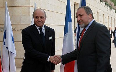 French Foreign Minister Laurent Fabius, left, and his Israeli counterpart Avigdor Liberman deliver statements to the media in Jerusalem on Sunday (photo credit: Yossi Zamir/Flash90)