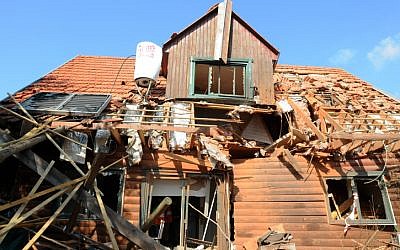 A house in the village of Timorim, in central Israel, was hit by a rocket fired by Gaza terrorists, November 19, 2012. (photo credit: Yossi Zeliger/Flash90)