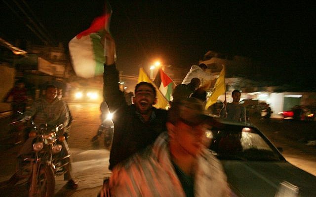 Palestinians celebrate in the streets of Gaza as Israel and the Islamist Hamas movement agreed on Wednesday to an Egyptian-sponsored ceasefire to halt an eight-day conflict November 21, 2012 (photo credit: Abed Rahim Khatib/Flash90)
