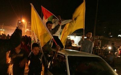Residents of Gaza celebrate the ceasefire agreement, Wednesday (photo credit: Abed Rahim Khatib/Flash90)