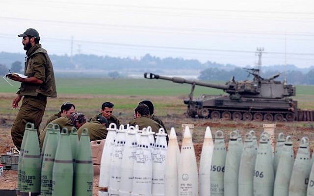 Illustrative photo of Israeli soldiers next to a mobile artillery unit outside the northern Gaza Strip during Operation Pillar of Defense (photo credit:Yossi Zeliger/Flash90)
