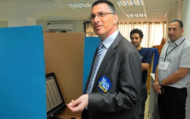 Minister of Education Gideon Sa'ar tries to cast his vote as Likud opened the polls for its primary elections on Sunday (photo credit: Yossi Zeliger/Flash90)