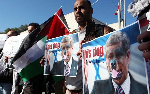 A Palestinian man in Ramallah protests against Canada's Prime Minister Stephen Harper. Canada is voting against the Palestinian request to upgrade its status in the UN (photo credit: Issam Rimawi/Flash90) A Palestinian man in Ramallah protests against Canada's Prime Minister Stephen Harper. Canada is voting against the Palestinian request to upgrade its status in the UN (photo credit: Issam Rimawi/Flash90)