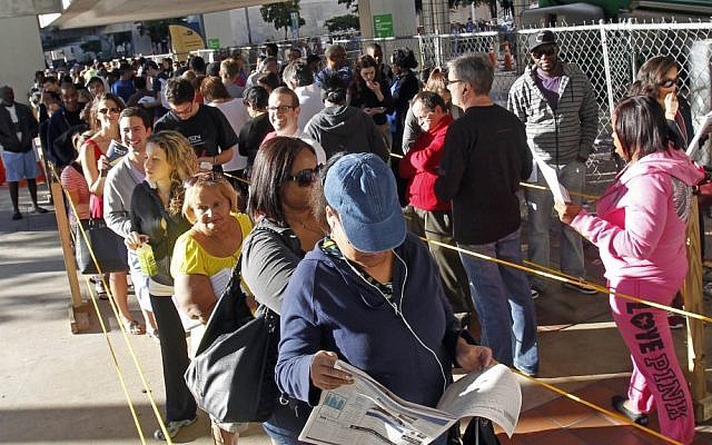Early voters stand in line in Miami, Florida, on Saturday (photo credit: AP/Alan Diaz)