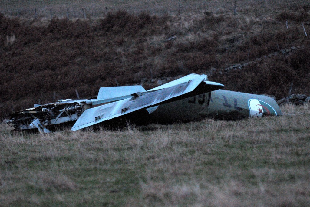Part of the wreckage of an Algerian military cargo plane which crashed in Trelans, southern France, on Friday. The plane went down with six people aboard, according to local police. (photo credit: AP Photo/Eva Koord) 
