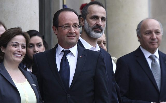 French President Francois Hollande, second from left, head of the new Syrian National Coalition for Opposition and Revolutionary Forces Mouaz al-Khatib, second from right, Syrian opposition member Suheir Atassi, left, and French Foreign Minister Laurent Fabius, right, pose for photos prior to a meeting at the Elysee Palace, Paris, Saturday, November 17, 2012 (photo credit: AP/Thibault Camus)