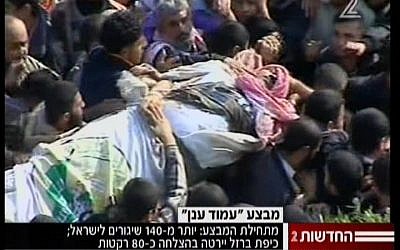 Palestinians in Gaza carry the body of slain Hamas military chief Ahmed Jabari on Thursday, November 15 (screen capture: Channel 2)