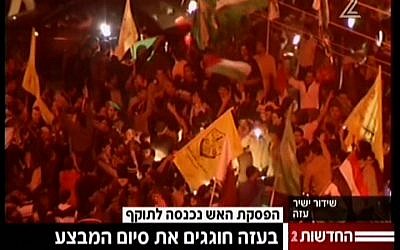 Palestinians in Gaza celebrate the ceasefire on Thursday, November 21 (screen capture: Channel 2)