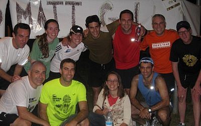 Friends and family with Matt Krieger (top, center) at the end of his personal marathon (photo credit: courtesy)