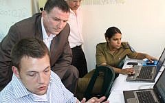 Minister Yuli Edelstein (center) in the Social Media Operations Center (Photo credit: Courtesy)