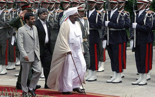 Sudanese President Omar al-Bashir, center, and Iranian President Mahmoud Ahmadinejad, left, review an honor guard, in Tehran, Iran, in 2006. (photo credit: AP/Hasan Sarbakhshian, file) Sudanese President Omar al-Bashir, center, and Iranian President Mahmoud Ahmadinejad, left, review an honor guard, in Tehran, Iran, in 2006. (photo credit: AP/Hasan Sarbakhshian, file)
