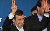 Iranian President Mahmoud Ahmadinejad makes peace gestures on the sidelines of the Bali Democracy Forum in Indonesia last November (photo credit: AP/Dita Alangkara)