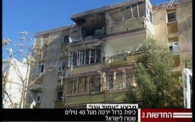 A residential building in Kiryat Malachi suffered a direct hit by a rocket fired from Gaza that killed three people and critically wounded an infant on Thursday, November 15 (screen capture Channel 2 News) A residential building in Kiryat Malachi suffered a direct hit by a rocket fired from Gaza that killed three people and critically wounded an infant on Thursday, November 15 (screen capture Channel 2 News)