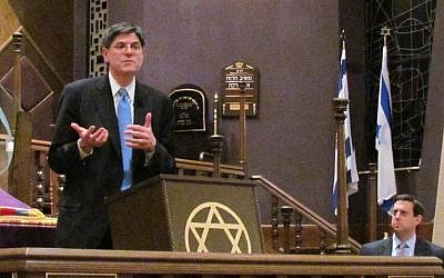 Obama surrogate Jack Lew makes a point during his debate with Romney surrogate Tevi Troy at Green Road Synagogue in Beachwood, Ohio, with moderator Nathan Diament listening in the background. (Ron Kampeas/JTA)