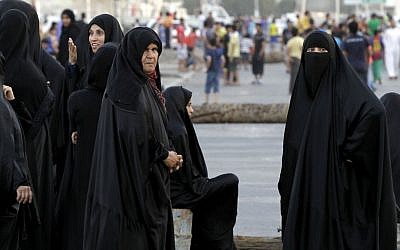 After being dispersed by riot police firing tear gas, Bahraini anti-government protesters return to the streets and resume their demonstration in Malkiya, Bahrain in 2012 (photo credit: AP/Hasan Jamali)