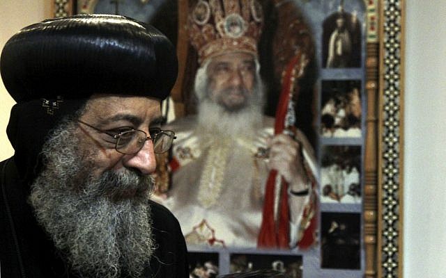 Bishop Tawadros, 60, soon to be Pope Tawadros II greets well-wishers, not shown, after being named the 118th Coptic Pope in the Wadi Natrun Monastery complex northwest of Cairo, Egypt, Sunday, November 4, 2012 (photo credit: AP/Roger Anis) Bishop Tawadros, 60, soon to be Pope Tawadros II greets well-wishers, not shown, after being named the 118th Coptic Pope in the Wadi Natrun Monastery complex northwest of Cairo, Egypt, Sunday, November 4, 2012 (photo credit: AP/Roger Anis)