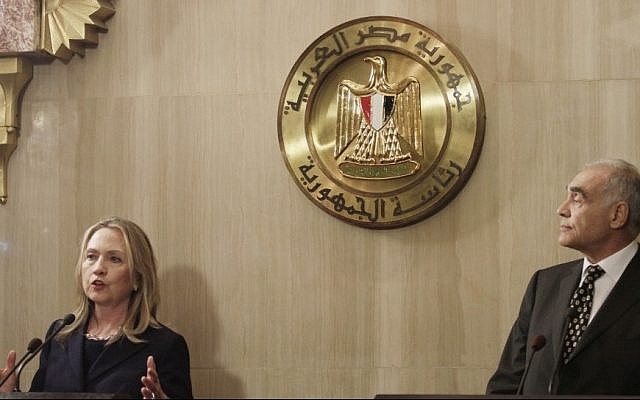 Hillary Rodham Clinton (left) with Mohammed Kamel Amr in Egypt (photo credit: Maya Alleruzzo/AP)