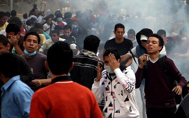 Egyptian protesters clash with security forces, not pictured, near Tahrir Square in Cairo, Egypt, Sunday, Nov. 25, 2012 (photo credit: AP/Ahmed Gomaa)