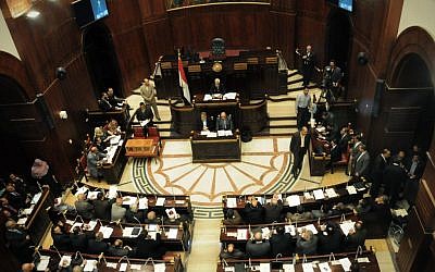 The Islamist-dominated panel vote on a final draft of a new Egyptian constitution in Cairo, Egypt, Thursday, Nov. 29 (photo credit: AP/Mohammed Asad)