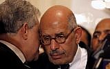 Egyptian pro-democracy figure and the former head of the International Atomic Energy Agency Mohamed ElBaradei, center, is expected to speak Friday at a rally against President Mohammed Morsi's assumption of sweeping new powers. (photo credit: AP/Mostafa El Shemy)