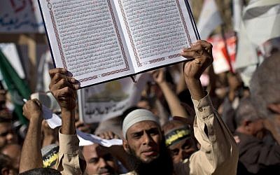 Demonstrators demand 'God's law' in Tahrir square. (photo credit: AP) Demonstrators demand 'God's law' in Tahrir square. (photo credit: AP)