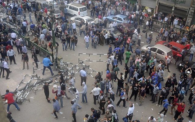 Egyptian protesters gather outside the country's high court in Cairo on Saturday. (photo credit: AP/Mohammed Asad)