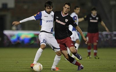 Athletic Bilbao's Erik Moran, right, challenges for the ball against Hapoel Kiryat Shmona's Darko Tasevski during their Europa League group I soccer match in Haifa on Wednesday. (AP Photo/Dan Balilty)