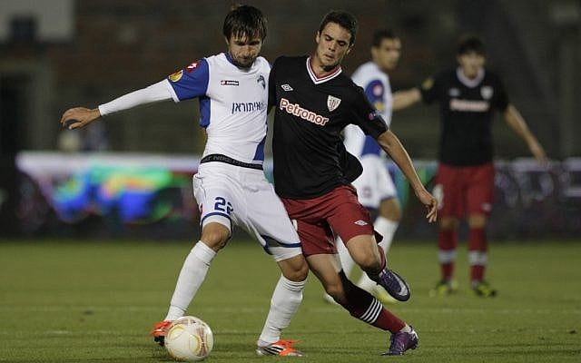 Athletic Bilbao's Erik Moran, right, challenges for the ball against Hapoel Kiryat Shmona's Darko Tasevski during their Europa League group I soccer match in Haifa on Wednesday. (AP Photo/Dan Balilty) Athletic Bilbao's Erik Moran, right, challenges for the ball against Hapoel Kiryat Shmona's Darko Tasevski during their Europa League group I soccer match in Haifa on Wednesday. (AP Photo/Dan Balilty)