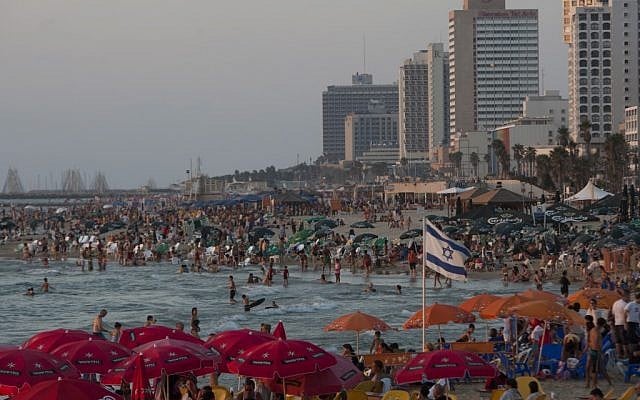 People enjoy the Mediterranean Sea in Tel Aviv, Israel. The freewheeling seaside oasis of Tel Aviv has long served as an escape from the troubles of everyday Israel. Now, it is also the target of rockets fired by Hamas terrorists in the Gaza Strip. (photo credit: AP/Ariel Schalit) People enjoy the Mediterranean Sea in Tel Aviv, Israel. The freewheeling seaside oasis of Tel Aviv has long served as an escape from the troubles of everyday Israel. Now, it is also the target of rockets fired by Hamas terrorists in the Gaza Strip. (photo credit: AP/Ariel Schalit)