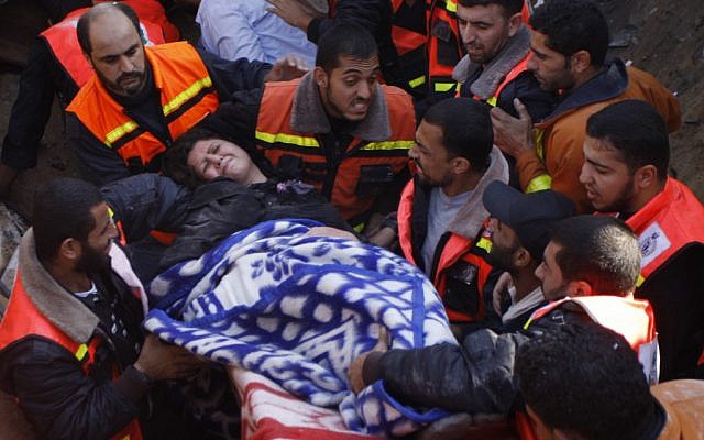 A member of the Abdel Aal family is rescued after his family house collapsed after an Israeli forces strike in the Tufah neighborhood, Gaza City, on Sunday, November 18, 2012 (photo credit: AP Photo/Majed Hamdan) A member of the Abdel Aal family is rescued after his family house collapsed after an Israeli forces strike in the Tufah neighborhood, Gaza City, on Sunday, November 18, 2012 (photo credit: AP Photo/Majed Hamdan)