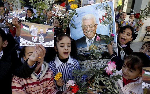 Palestinian schoolgirls hold pictures of President Mahmoud Abbas with Yasser Arafat, flowers and olive branches during a rally supporting the Palestinian UN bid for observer state status, in the West Bank city of Nablus, Wednesday, Nov. 28, 2012. (photo credit:AP/Nasser Ishtayeh) Palestinian schoolgirls hold pictures of President Mahmoud Abbas with Yasser Arafat, flowers and olive branches during a rally supporting the Palestinian UN bid for observer state status, in the West Bank city of Nablus, Wednesday, Nov. 28, 2012. (photo credit:AP/Nasser Ishtayeh)