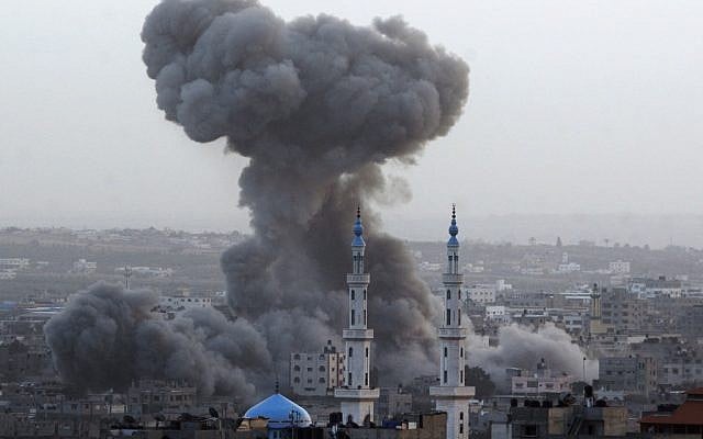 Smoke rises after an Israeli air force strike in Gaza City on Saturday. (photo credit: AP/Hatem Moussa)