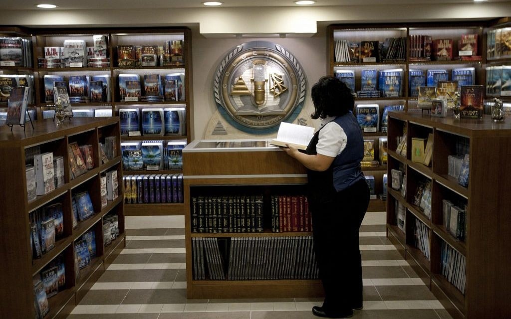 A librarian goes through books at the library of the Scientology center in the port city of Jaffa Tel Aviv, Nov. 7, 2012. (photo credit:AP/Ariel Schalit) A librarian goes through books at the library of the Scientology center in the port city of Jaffa Tel Aviv, Nov. 7, 2012. (photo credit:AP/Ariel Schalit)