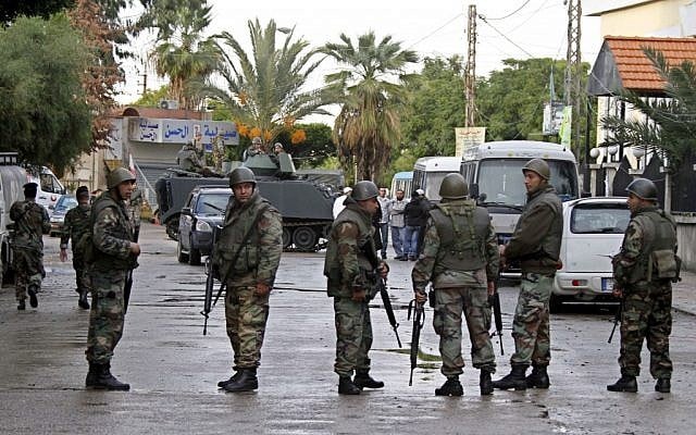Lebanese Army soldiers deploy after clashes between Sunni and Shiite gunmen in the southern port city of Sidon, Lebanon, Sunday, November 11. (photo credit: AP/Mohammed Zaatari)