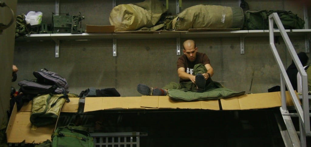 A reservist completing the transformation from civilian to soldier during the early days of Operation PIllar of Defense (Photo credit: Alon)