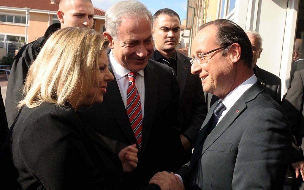 French President Francois Hollande greets Israeli Prime Minister Benjamin Netanyahu and his wife Sara at a ceremony at the Jewish school in Toulouse in 2012. (Avi Ohayon/GPO/Flash90/JTA)