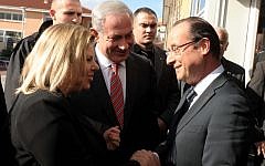 French President Francois Hollande greets Israeli Prime Minister Benjamin Netanyahu and his wife Sara at a ceremony at the Jewish school in Toulouse in 2012. (Avi Ohayon/GPO/Flash90/JTA)