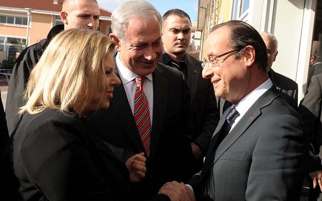 French President Francois Hollande greets Israeli Prime Minister Benjamin Netanyahu and his wife Sara at a ceremony at the Jewish school in Toulouse in 2012. (Avi Ohayon/GPO/Flash90/JTA)
