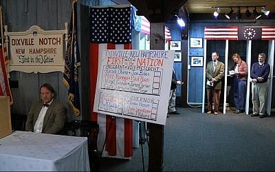 Voters wait to vote in Dixville Notch, N.H., shortly before midnight Monday, Nov. 5, (photo credit: AP/APTN)