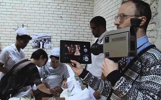 Nimrod Kamer (right) while filming the fake Barack Obama birth video (screen capture: YouTube) Nimrod Kamer (right) while filming the fake Barack Obama birth video (screen capture: YouTube)
