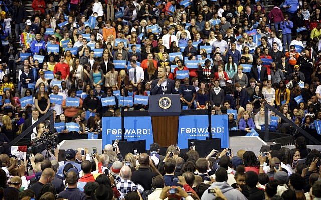 President Barack Obama begins to rub his throat while speaking to supporters during a campaign event at Fifth Third Arena in Cincinnati, Ohio on November 4. (photo credit: AP/Pablo Martinez Monsivais) President Barack Obama begins to rub his throat while speaking to supporters during a campaign event at Fifth Third Arena in Cincinnati, Ohio on November 4. (photo credit: AP/Pablo Martinez Monsivais)