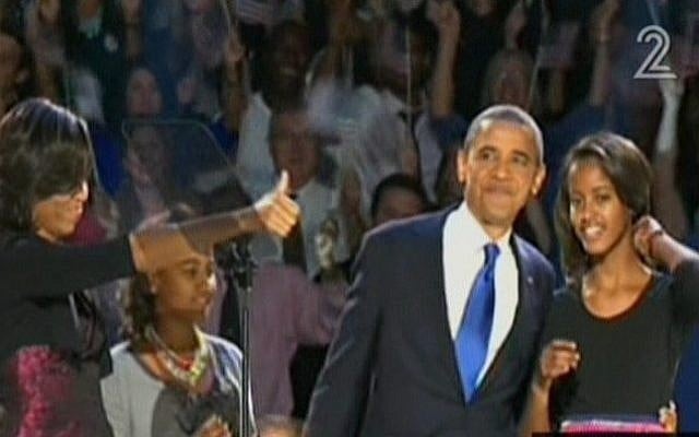 President Barack Obama and his family take the stage ahead of Obama's victory speech in Chicago on Wednesday, Nov. 7 (screen capture: Channel 2)