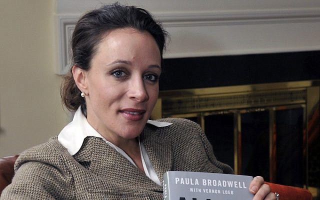 Paula Broadwell, author of the David Petraeus biography "All In," poses for photos in Charlotte, N.C. (photo credit: AP/The Charlotte Observer, T. Ortega Gaines)